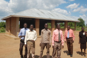 In April 2014, SHIM members visited and worked with Pastor Gaspher Okello, formerly of the islands, where he is serving in Patonga, in northern Uganda. Among those shown are: Okello, second from left; Pastor Robert Wafula, third from right, and Pastor Samson Mumbya, second from right.